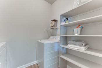 Laundry room with shelving and storage space